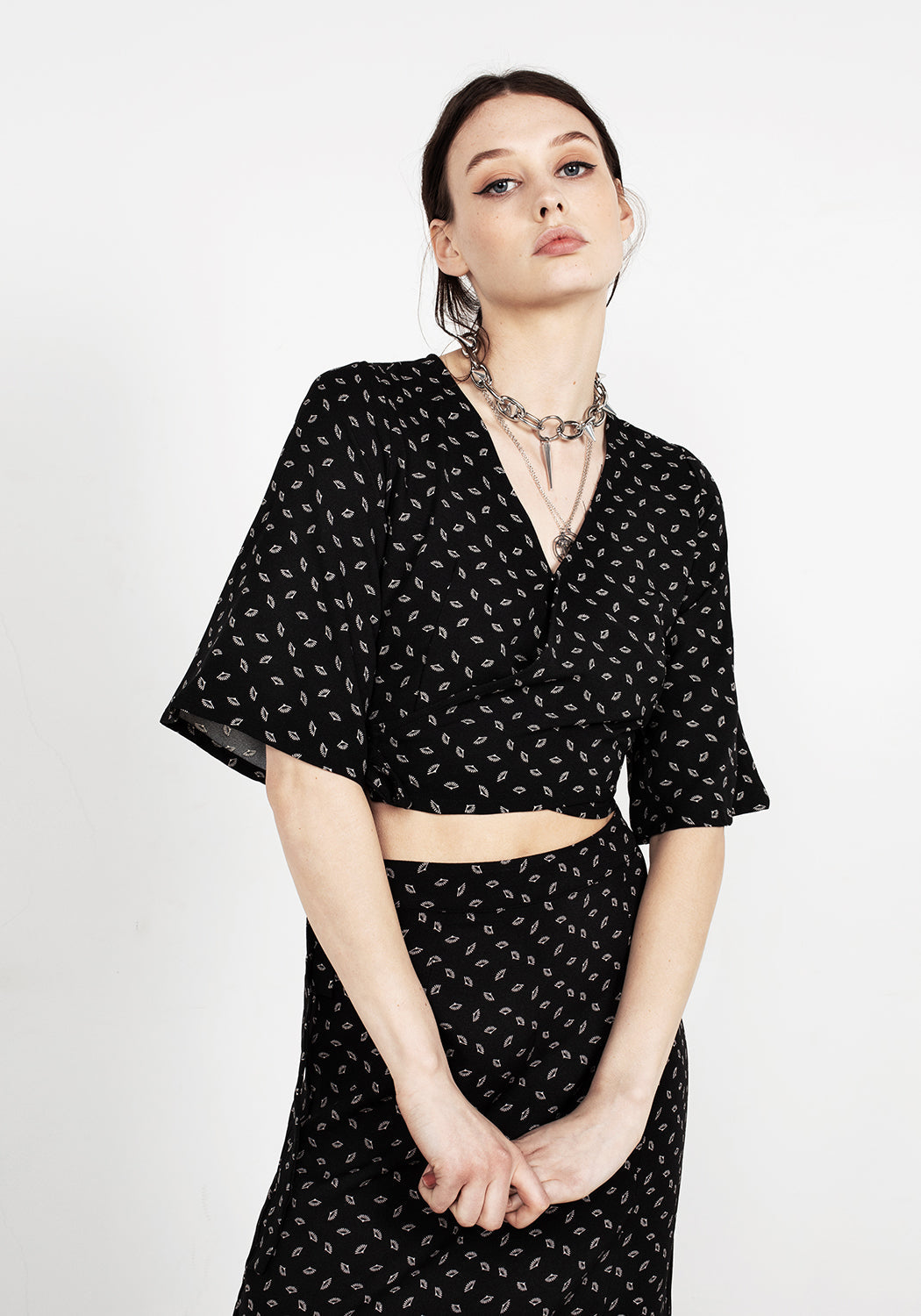 Black Wrap Top with Flared Sleeves & Surplice Neckline | Sensu