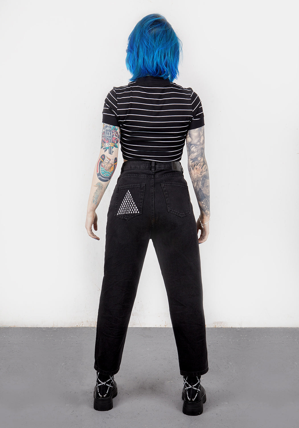 Distressed Black Denim Mom Jeans with Abracadabra Embroidery | Busted Knee Jean